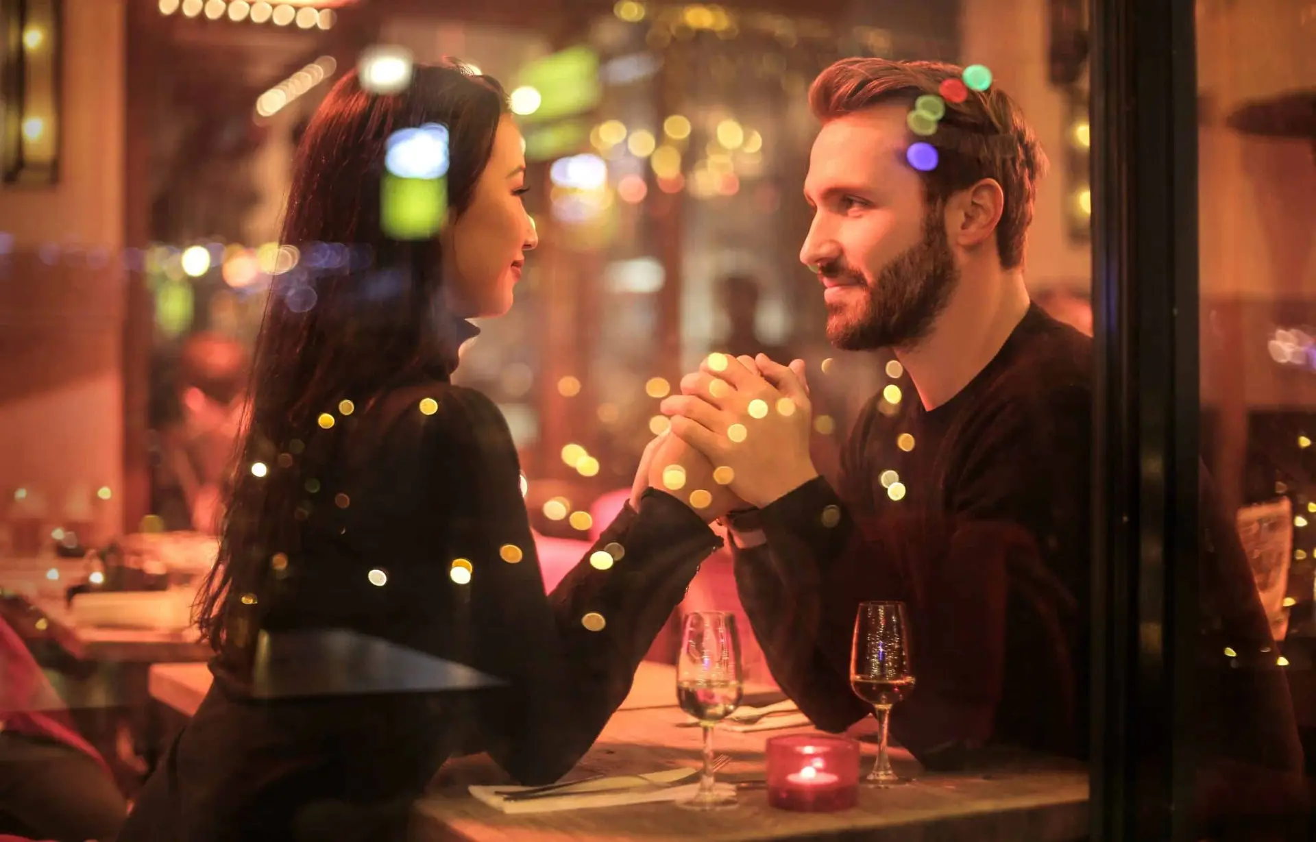 couple in love holding hands at a table