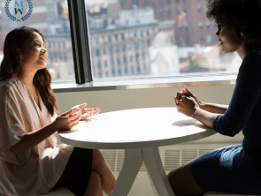 Wellness Today Blogs two women talking at a table