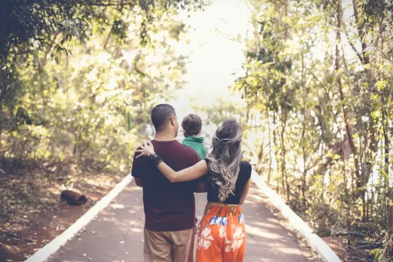 family walking down a wooded road