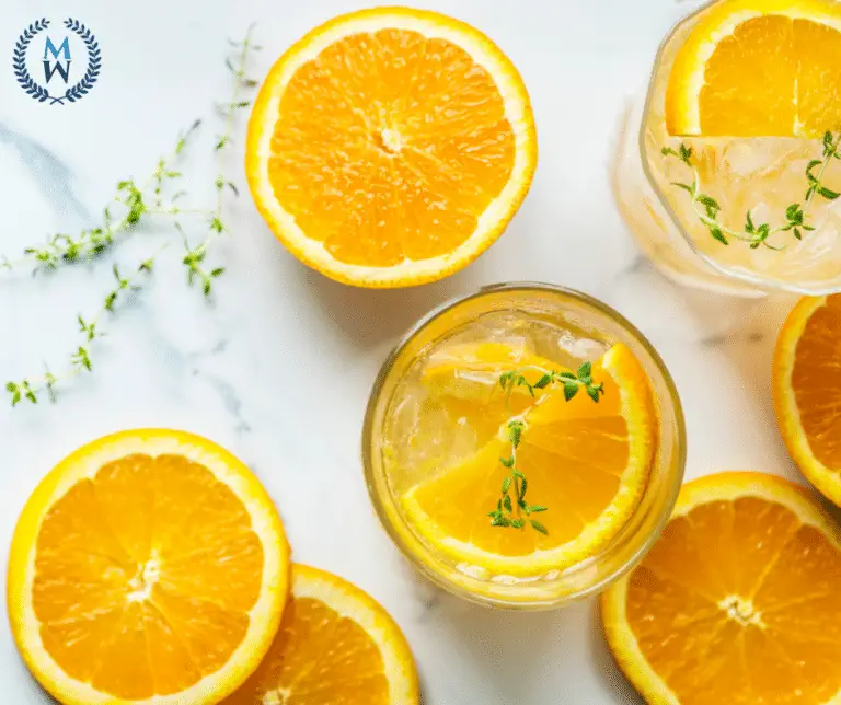 oranges and glasses of infused water ariel view