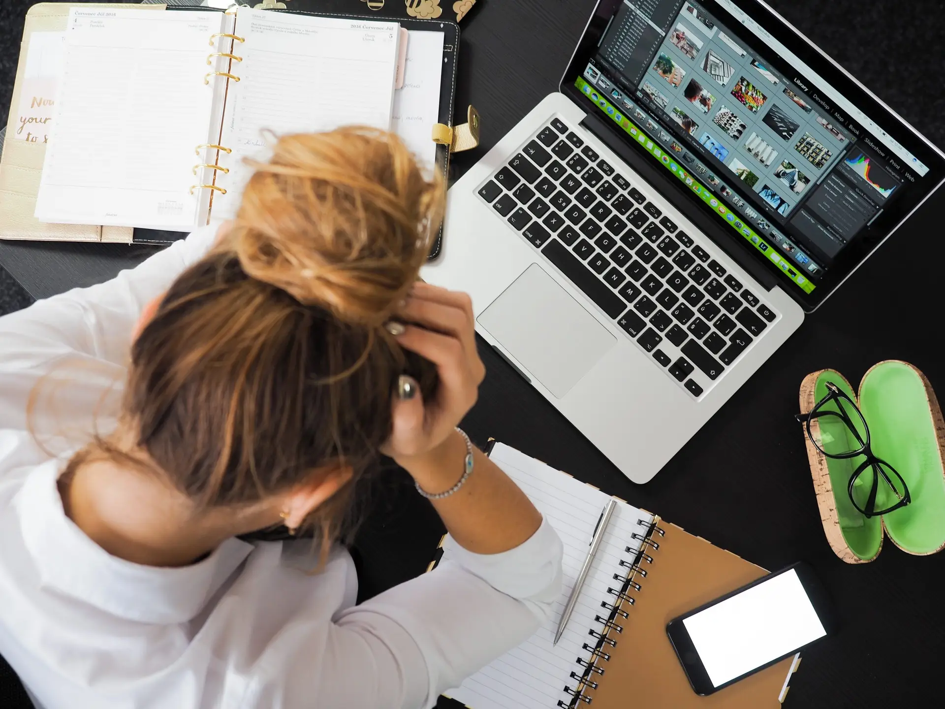 ariel view of overwhelmed woman working