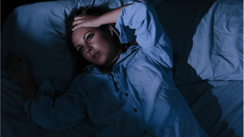 woman with insomnia in bed
