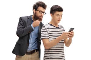 parent looking in teens phone 