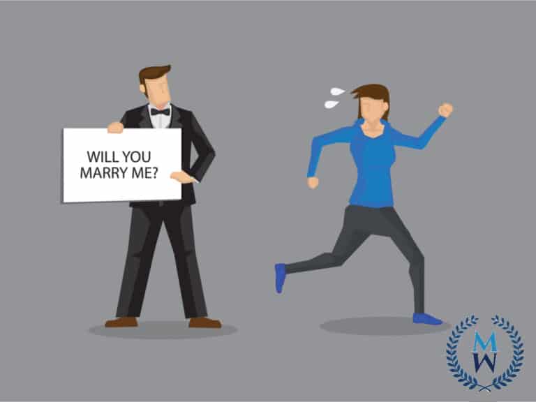 woman running from marriage proposal