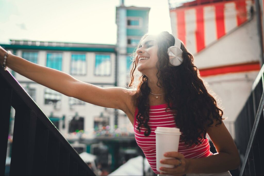 A confident and happy woman experiencing the opposite of apathy
