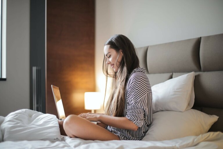 A young white woman seeing a therapist online for eating disorder therapy