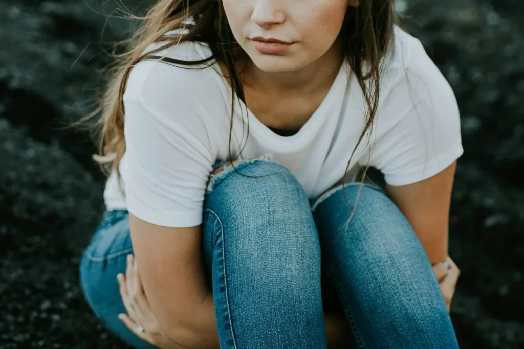 A woman reflecting on how her childhood trauma is holding her back in life.