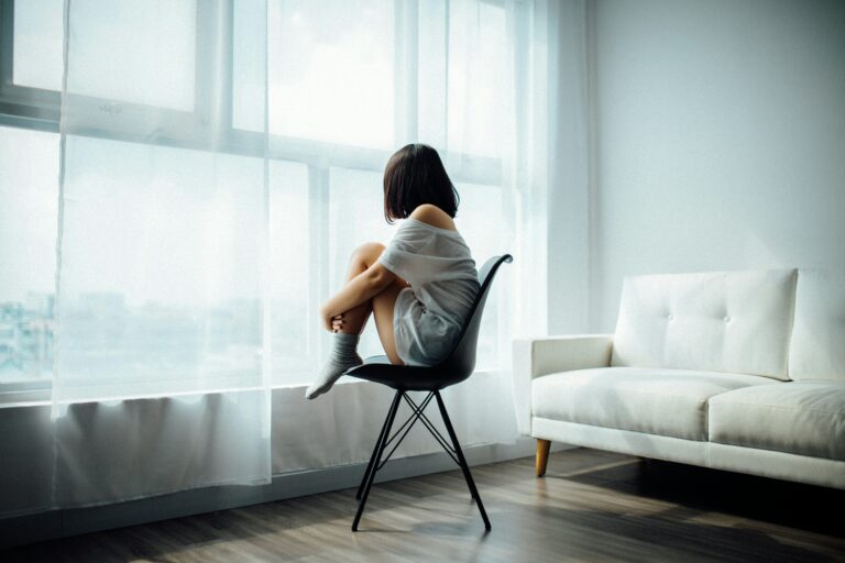 A woman reflecting on how her childhood trauma encourages her to self-sabotage.