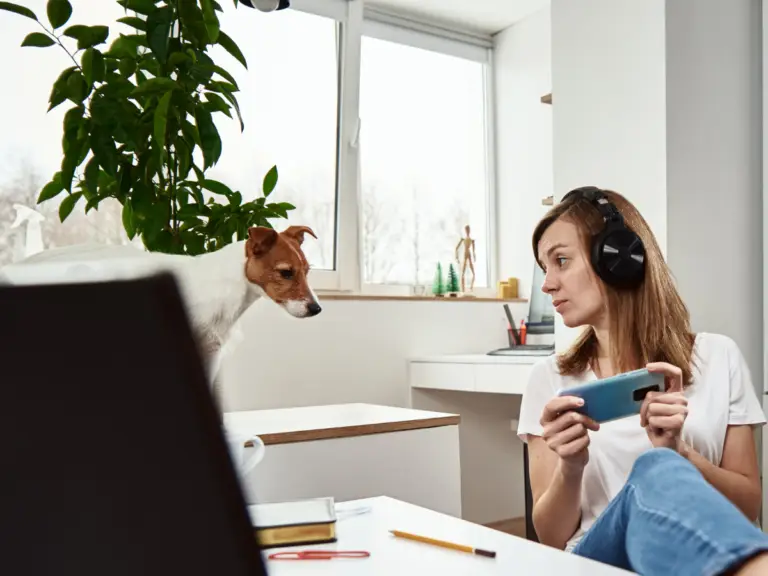 A young woman playing a video game, while she has trouble with concentration