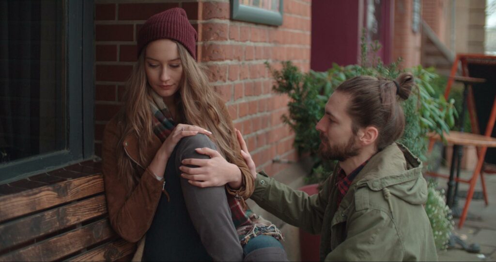 A man showing his partner empathy by being present for her.