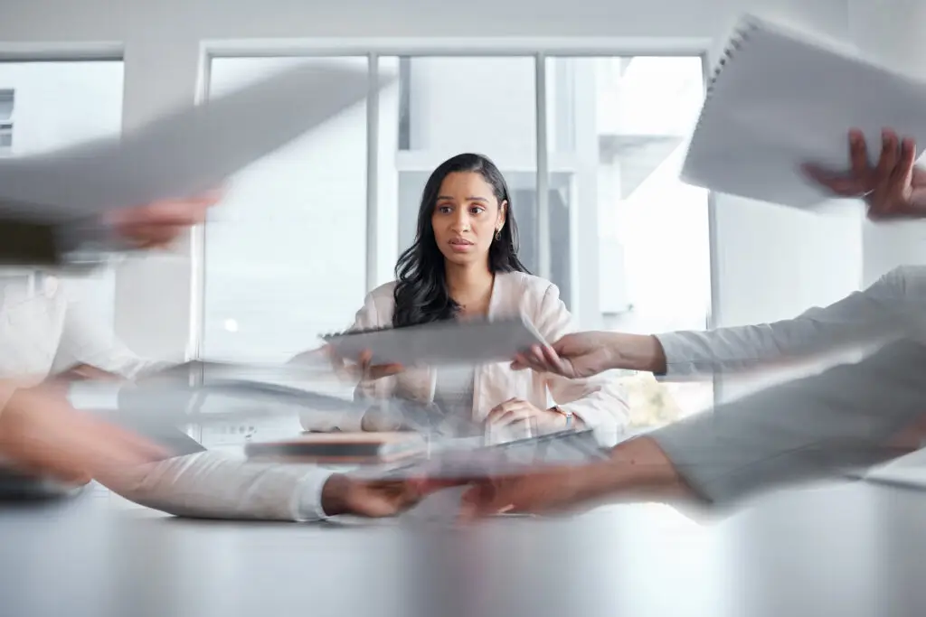 ADHD and Social Anxiety: 9 Important Differentiators, Plus 6 Evidence-Based Tips for Growth Confused young woman watching papers pass across the room in a blur, unsure what is going where – much like the experience of trying to disentangle ADHD and social anxiety symptoms.