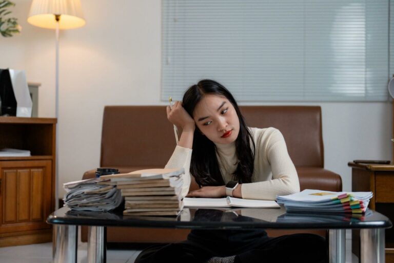 Pathological demand avoidance in adults creates a sense of paralysis when you are faced with big demands - like the paralysis the woman in this image is experiencing.