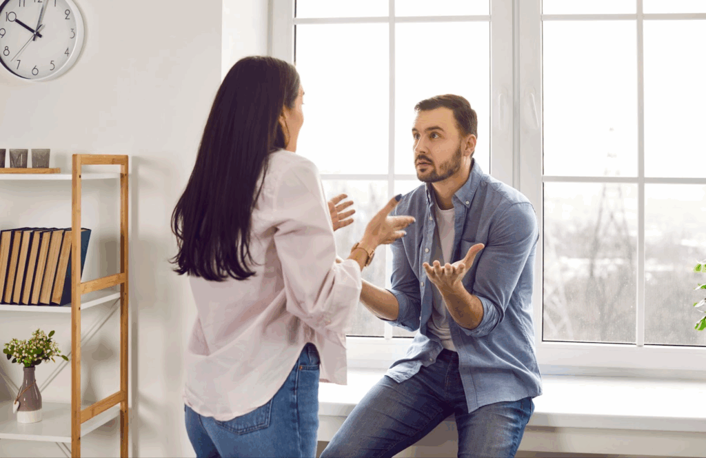 A man and woman arguing in a house, showcasing the divisive nature of weaponized incompetence.