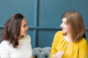 Two women talking about their feelings by using a variety of words to describe their emotions.
