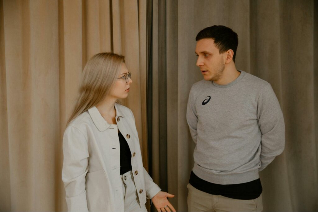 A couple having a disagreement because of her retroactive jealousy.