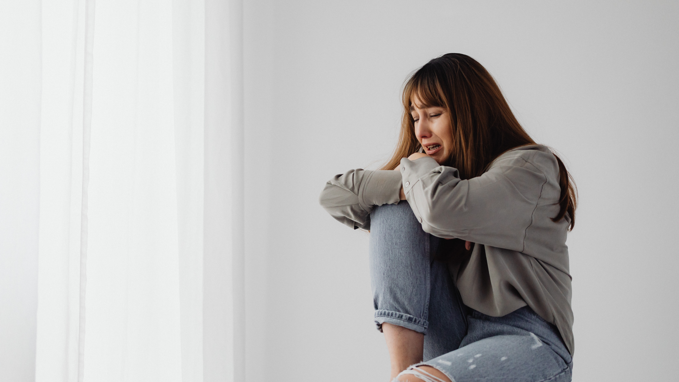 Woman experiencing confusion and emotional distress from gaslighting in a toxic relationship