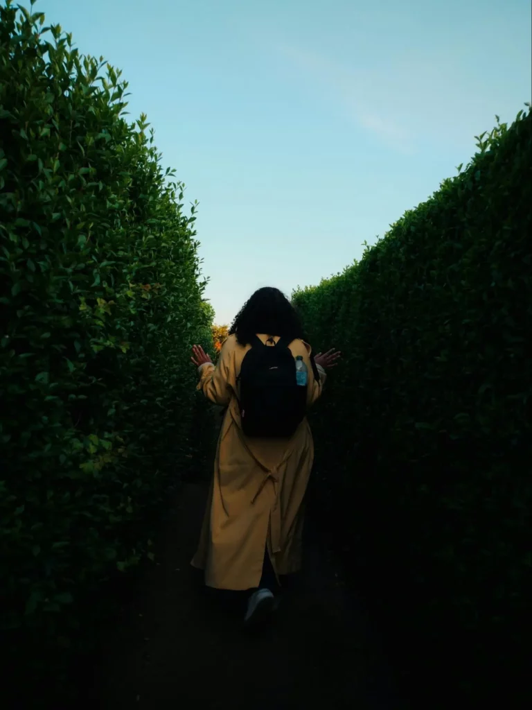 Woman figuring out how to break unhealthy relationship patterns as she navigates boundaries, deciding where to prune and where to allow growth.