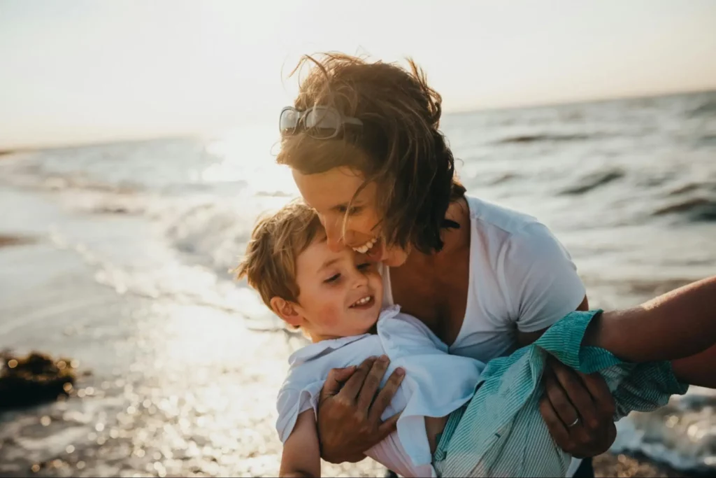 A mother who has worked hard through relationship issues to come out the other side enjoying a day at the beach with her son.