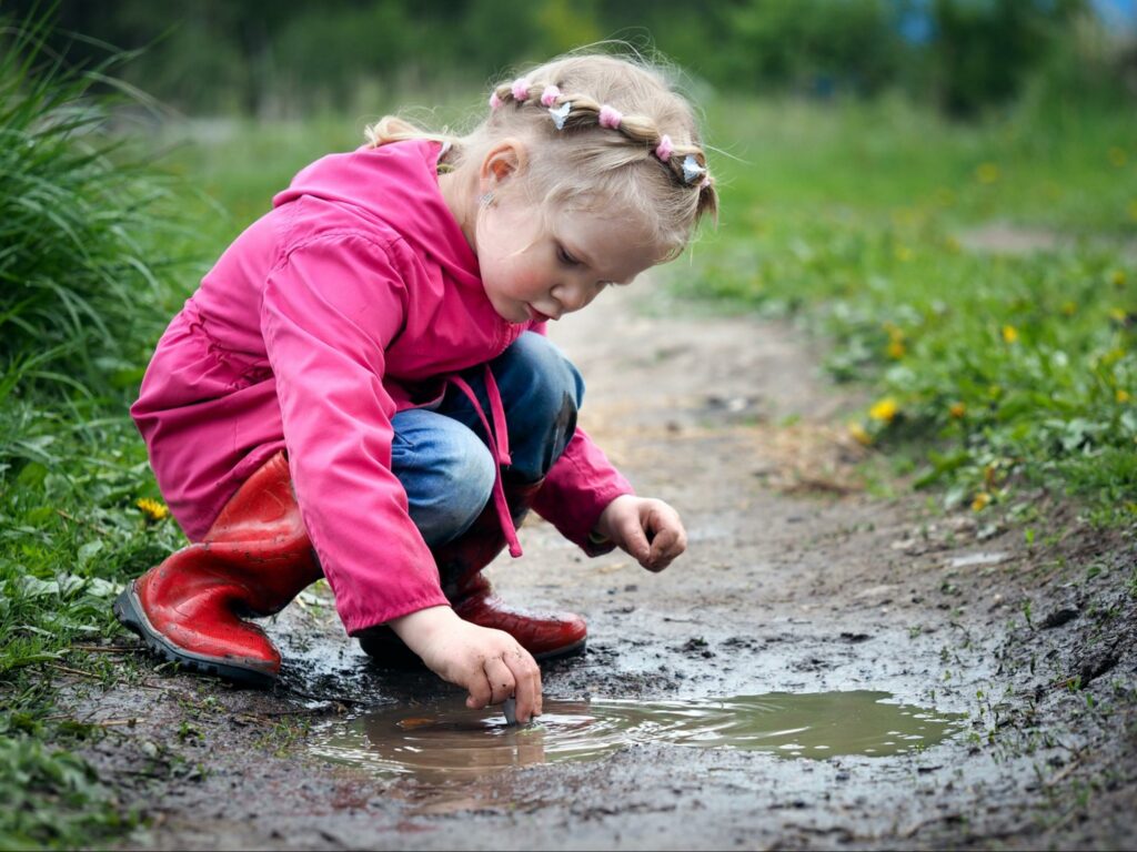 Little girl entering into the mess of her identity in order to bloom.
