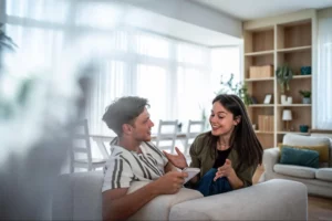 A couple in a meaningful conversation, demonstrating effective communication, which can improve relationship dynamics.