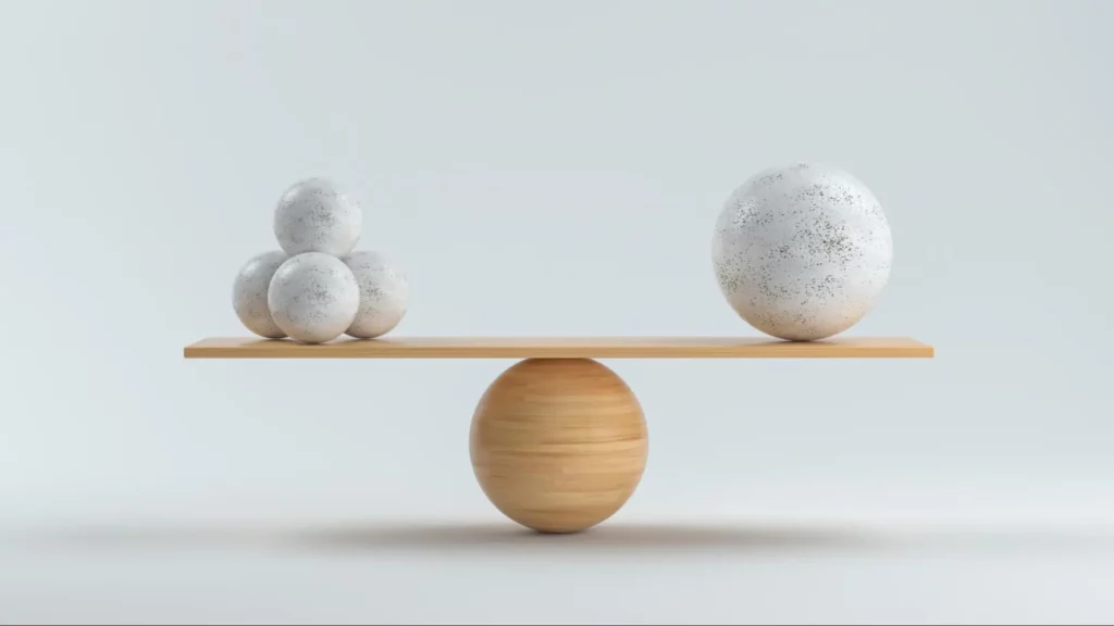 The balancing act in relationship dynamics is mirrored in the spheres in the photo.