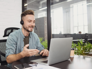 Man using a laptop for online ADHD treatment