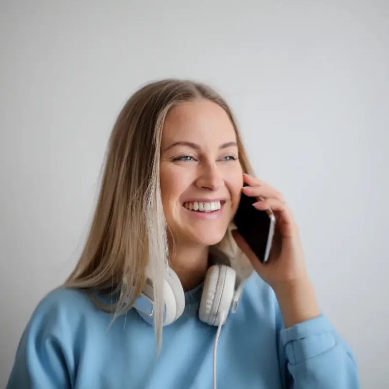 A woman in a phone call session, online therapy for caregivers