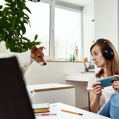 A young woman playing a video game, while she has trouble with concentration