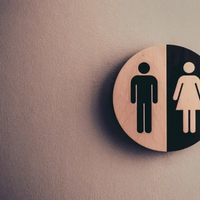 bathroom sign wiht female and male images