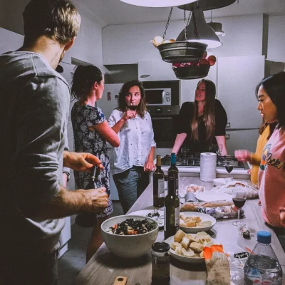 group of friends cooking and talking