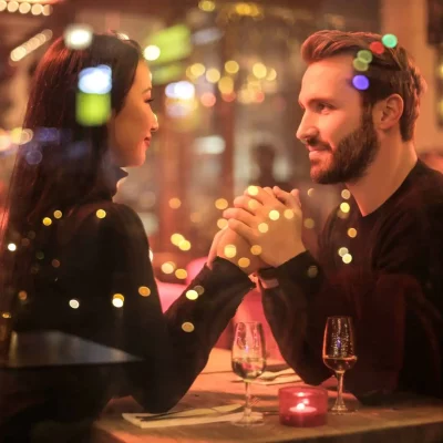 couple in love holding hands at a table