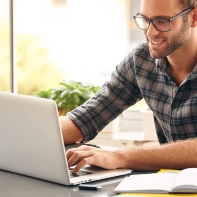 man on computer during online counseling