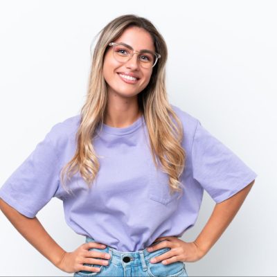 A woman who has learned how to build confidence, standing confidently with her hands on her hips.