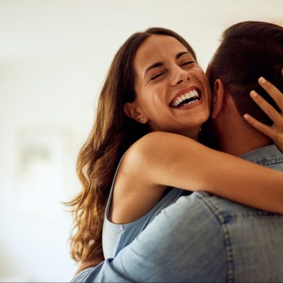 Monogamy Meaning Cover A happy couple embracing and smiling, showing the love, trust, and emotional connection in a monogamous relationship.