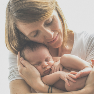 grandmother bonding with newborn grandbaby, setting him up for strong relationship attachment styles