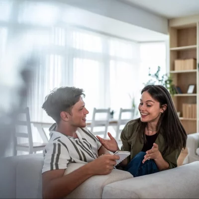 A couple in a meaningful conversation, demonstrating effective communication, which can improve relationship dynamics.