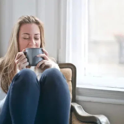 woman relaxing drinking cup of tea