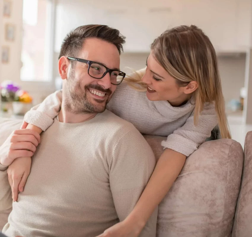 Happy young couple hugging and looking at each other marriage counseling