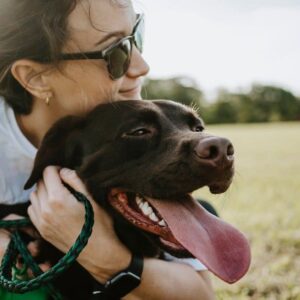 girl holding dog finding comfort