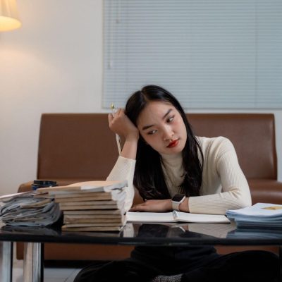 Pathological demand avoidance in adults creates a sense of paralysis when you are faced with big demands - like the paralysis the woman in this image is experiencing.